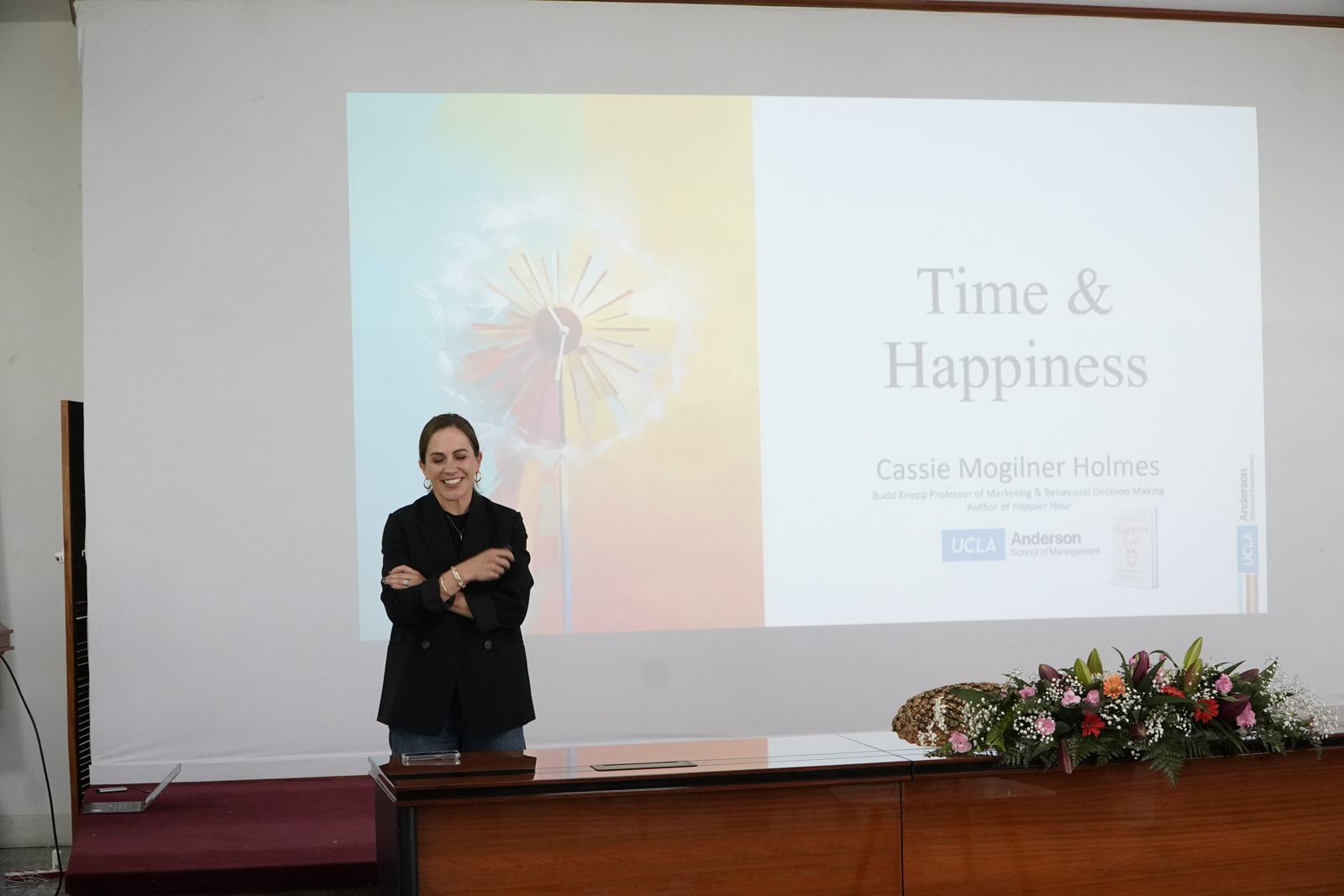 A scholar presenting a talk titled Time and Happiness at the forum in Bhutan